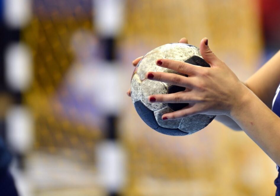 Handball Player about to shoot a handball into the goal.